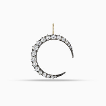 Antique diamond crescent moon pendant with old mine cut diamonds in silver on gold
