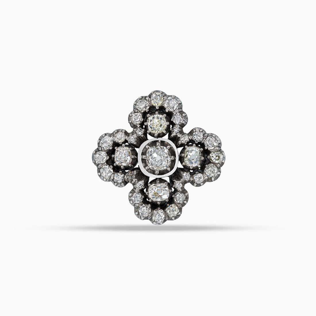 Antique diamond cross brooch in silver topped gold