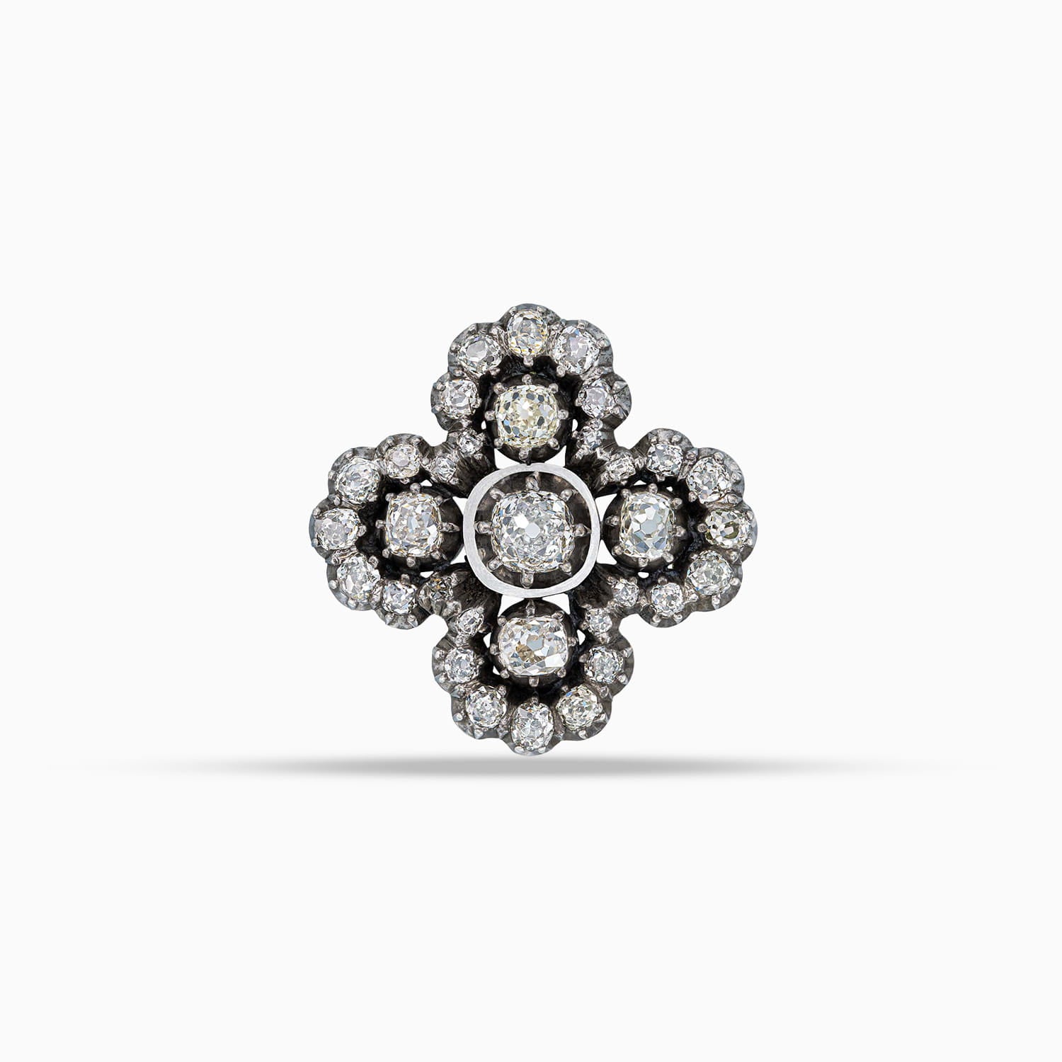 Antique diamond cross brooch in silver topped gold