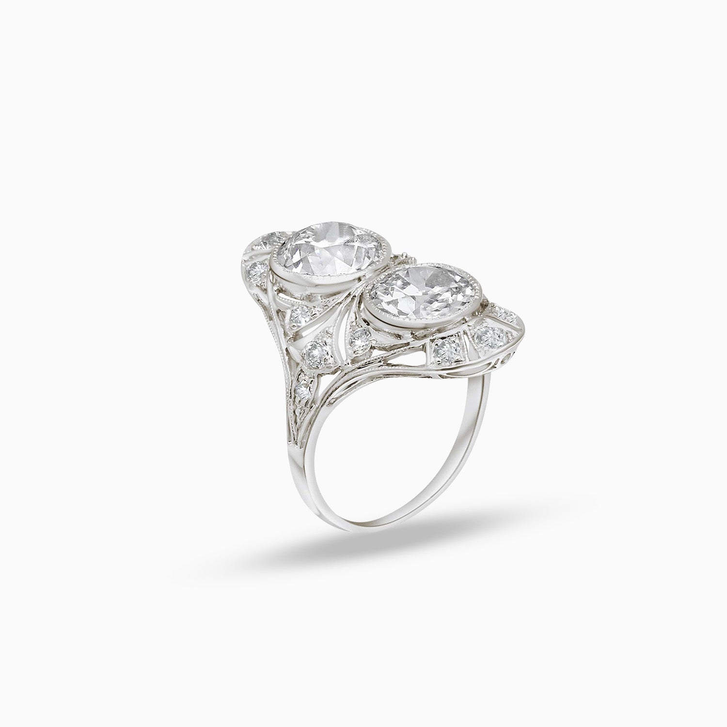 Side view of Art Deco double diamond ring with old cut diamond accents in 18K white gold