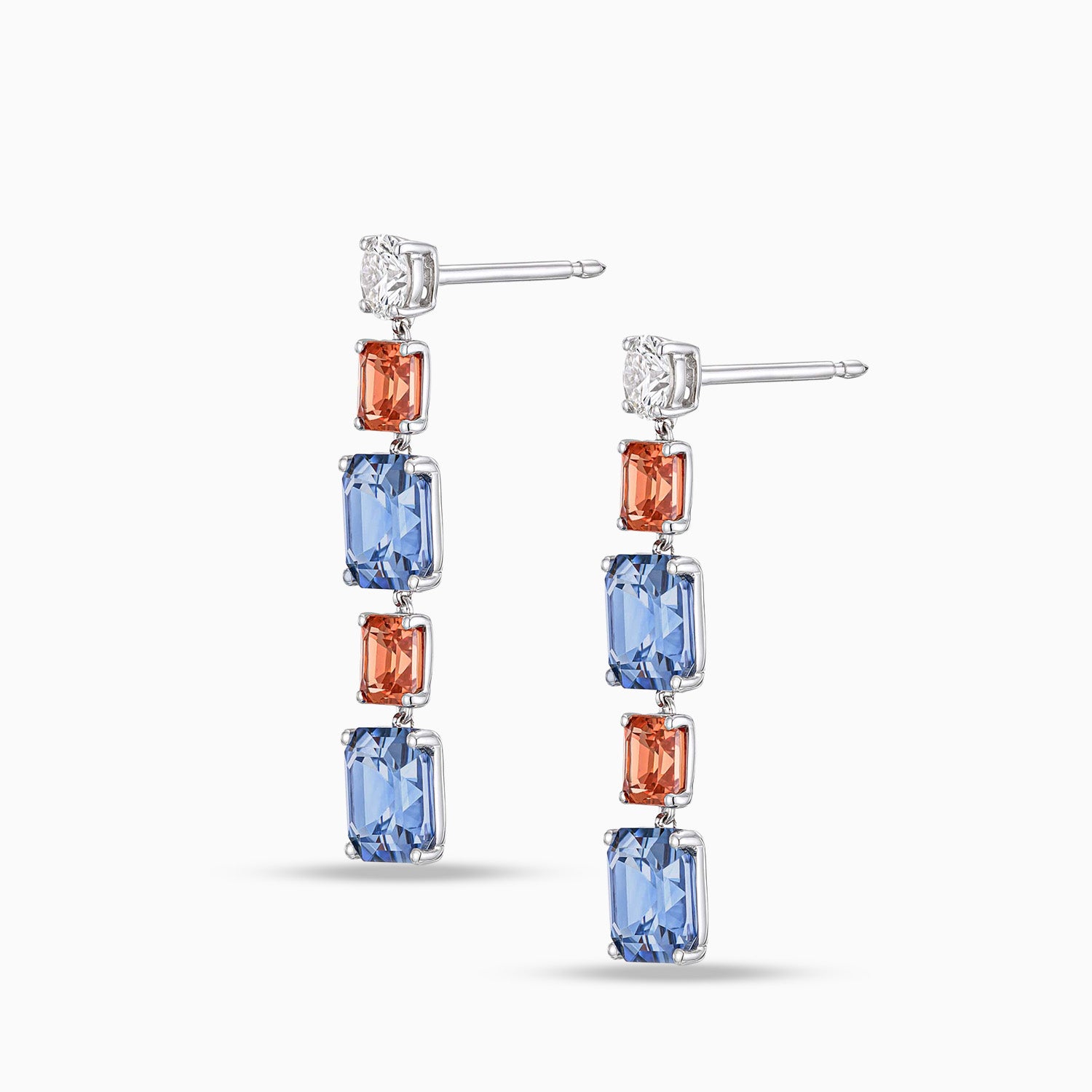 Blue and red Asscher cut sapphire drop earrings with round brilliant cut diamonds in 18K white gold