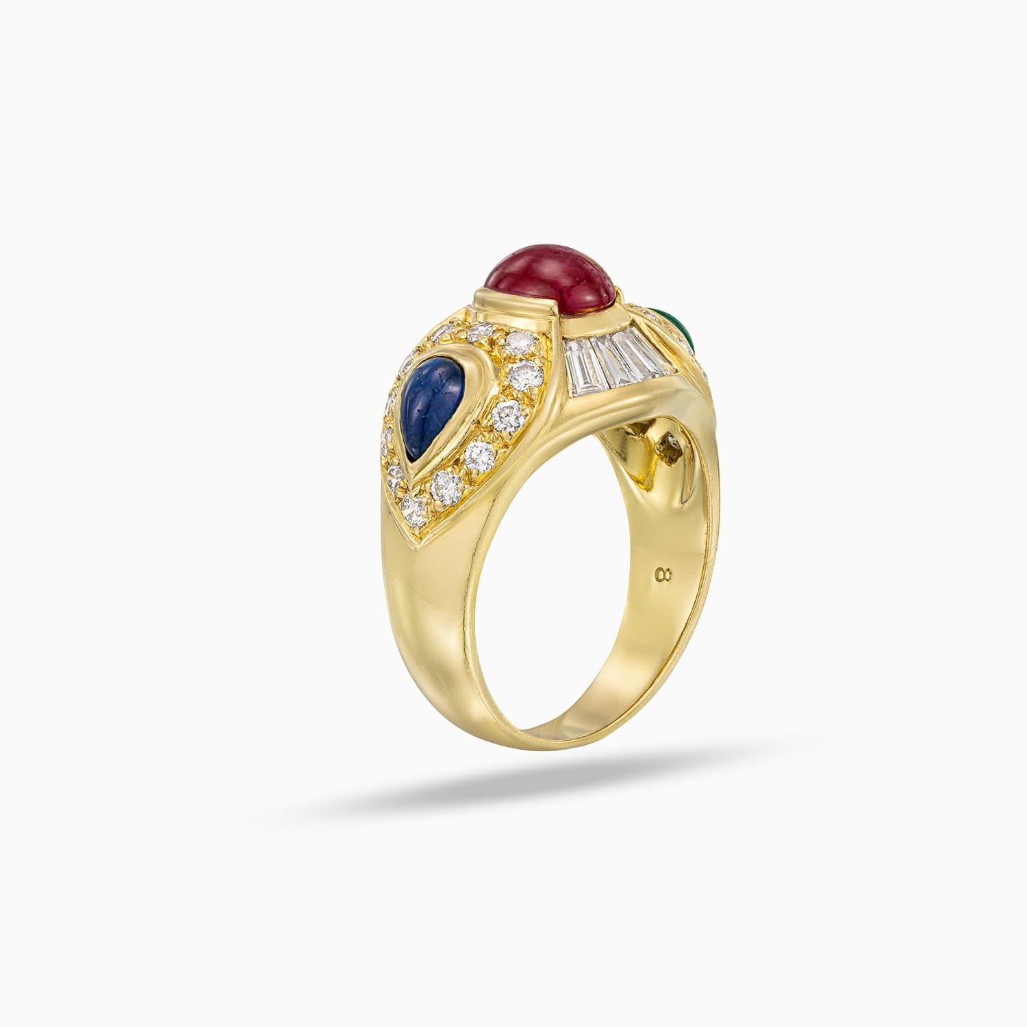 Side view of cabochon ruby ring with emerald, sapphire and diamond accents in 18K yellow gold