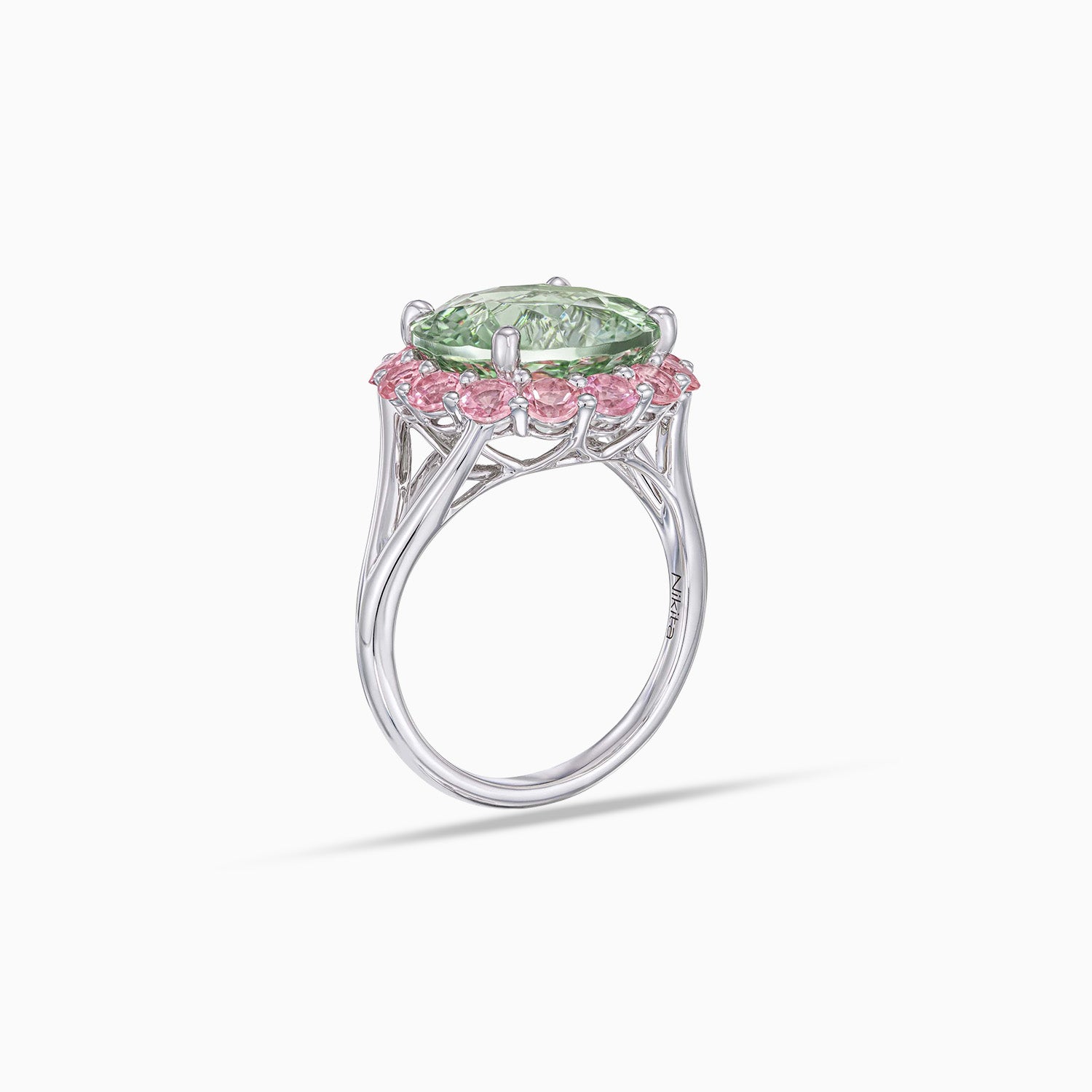 Side view of concave cut quartz ring with pink tourmaline halo in 18K white gold