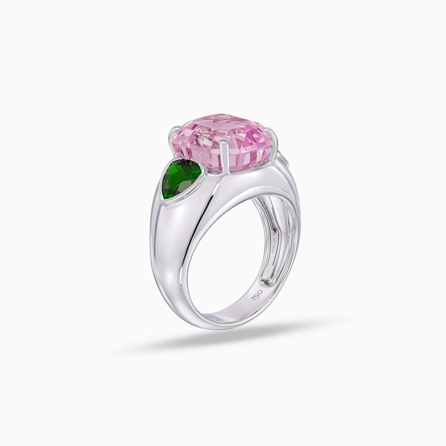 Side view of emerald cut kunzite ring with green tourmaline side stones in 18K white gold