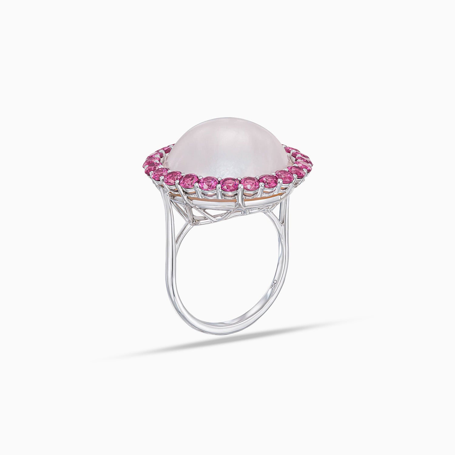 Side view of mabe cultured pearl dome ring with rhodolite halo in 18K white gold