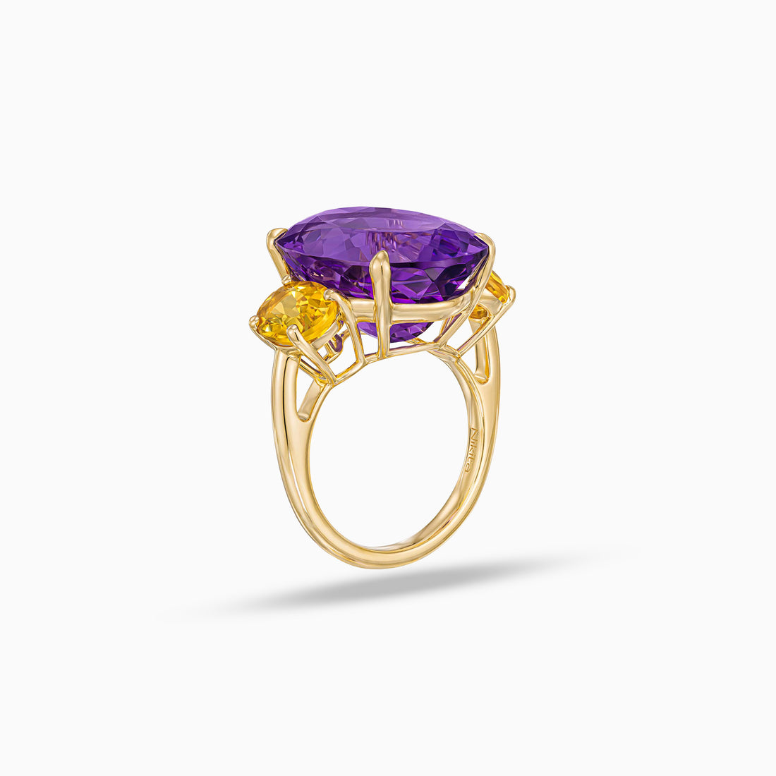 Oval shape amethyst ring with oval beryl side stones in 18K yellow gold