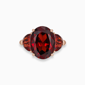 Oval shape garnet ring with half moon garnet side stones in 18K rose gold