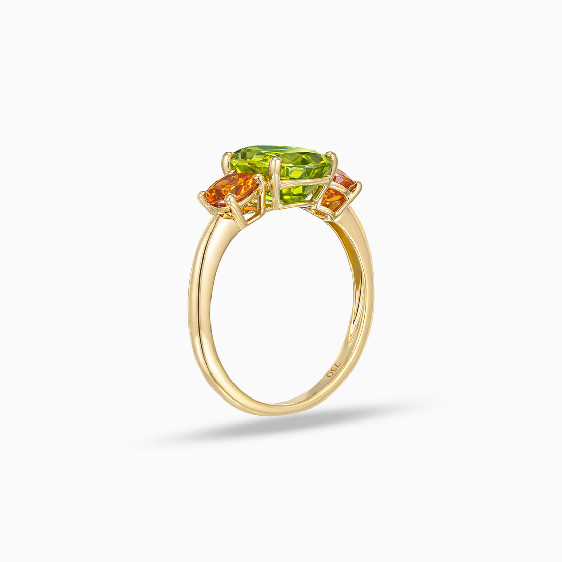 Oval shape peridot ring with round spessartite garnet side stones in 18K yellow gold