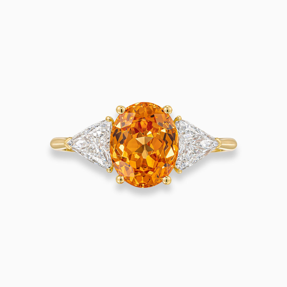 Oval shape spessartite garnet ring with trillion cut diamonds in 18K yellow gold