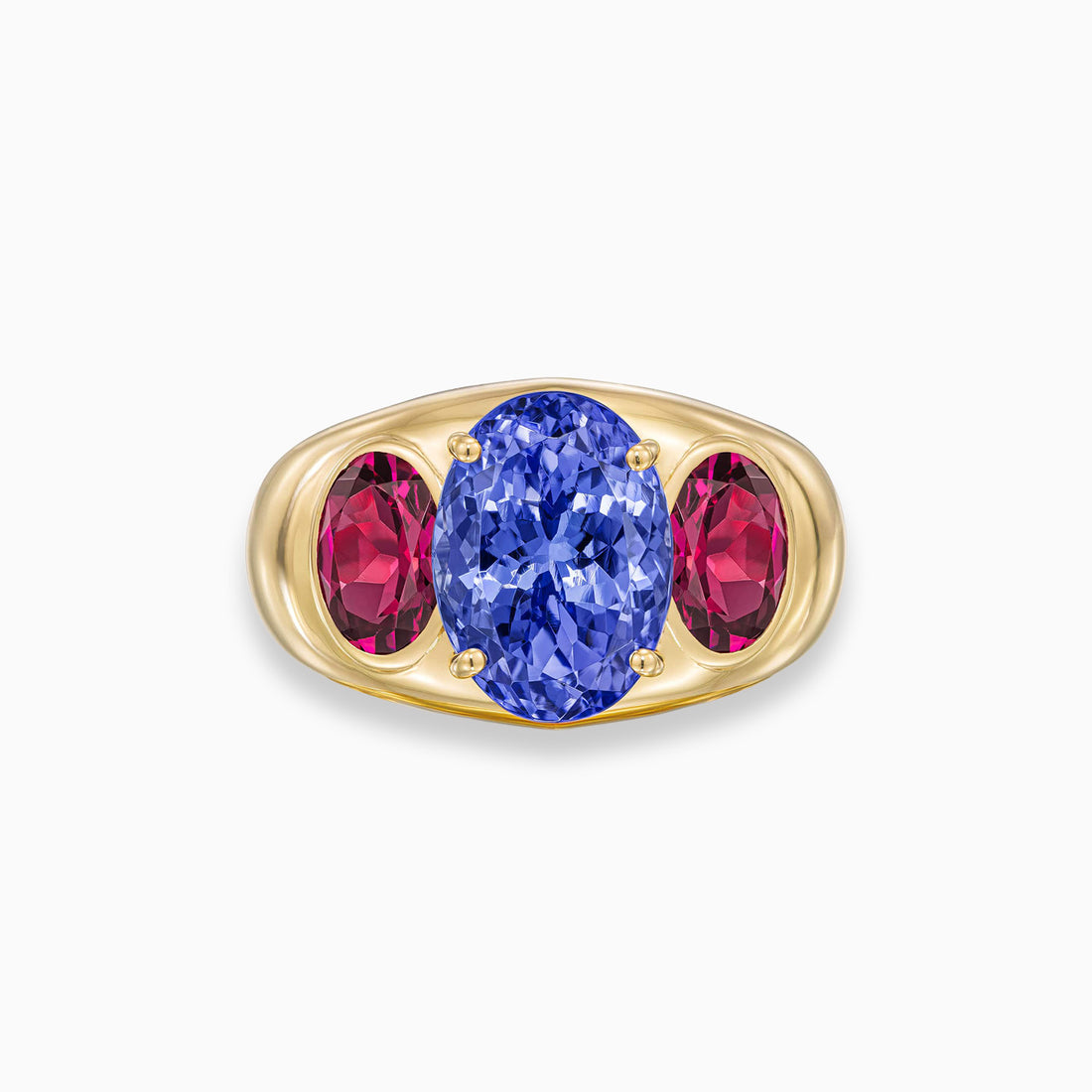 Oval shape tanzanite ring with oval grape garnet side stones in 18K yellow gold