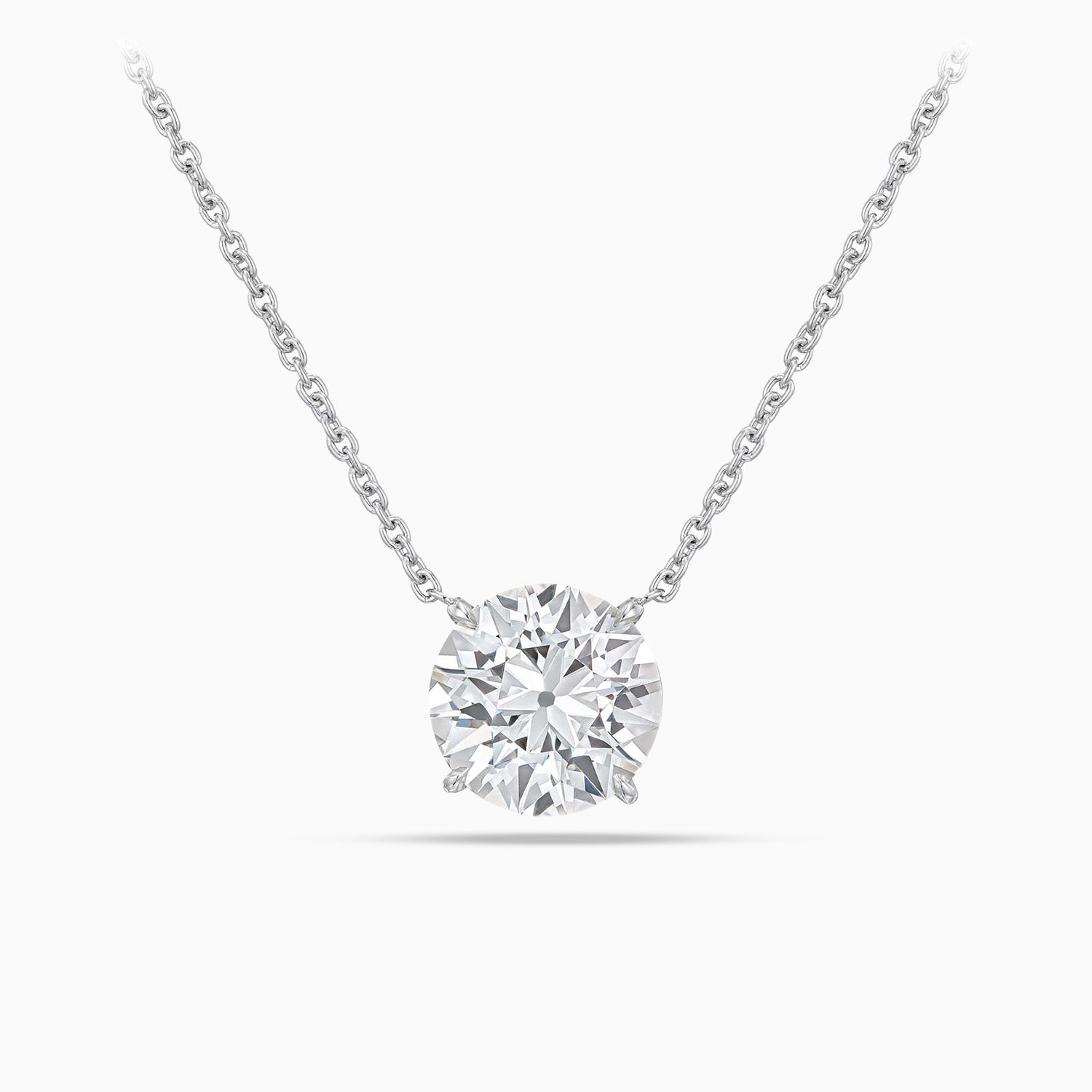 Close view of round brilliant cut diamond pendant in platinum