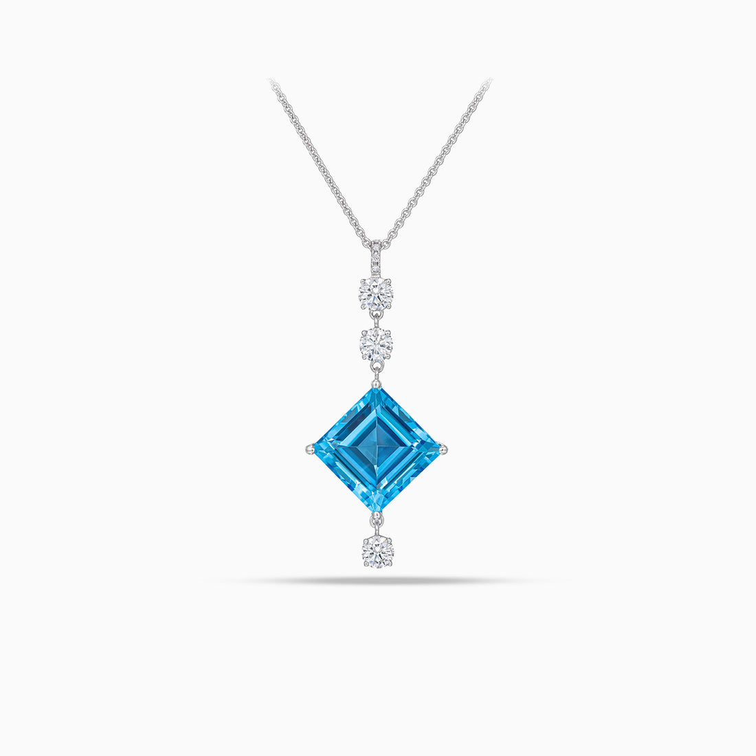 Princess cut topaz pendant with round brilliant cut diamonds in 18K white gold